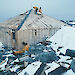 Specialists examine the roof and cladding of Mawson’s Hut