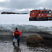 Woman collecting marine invertebrates with a dip-net near Casey station.