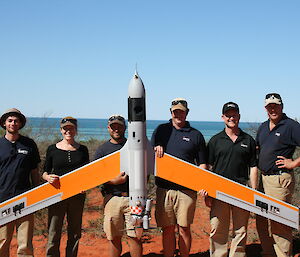Insitu Pacific UAV operators at Shark Bay with UAV in foreground