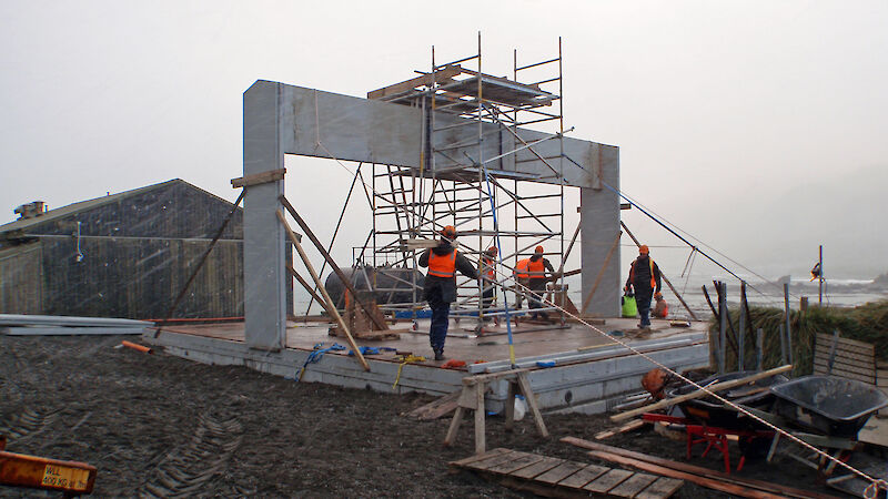 Tradesmen working on the building site for the new ARPANSA powerhouse on Macquarie Island.