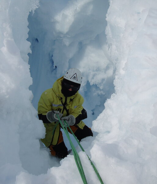 Expeditioner lowered down at a crevasse during field training near Mawson.