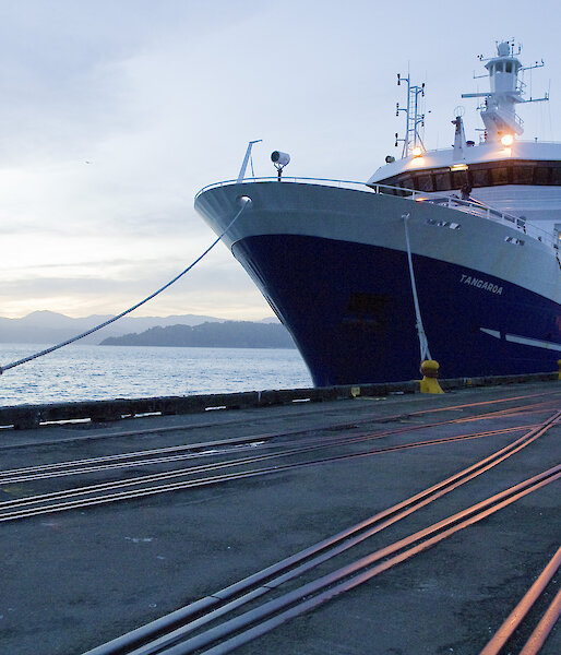 Ship docked alongside wharf