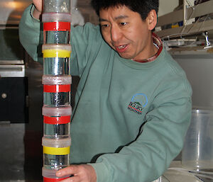 Dr So Kawaguchi with jars of krill collected from the Southern Ocean.