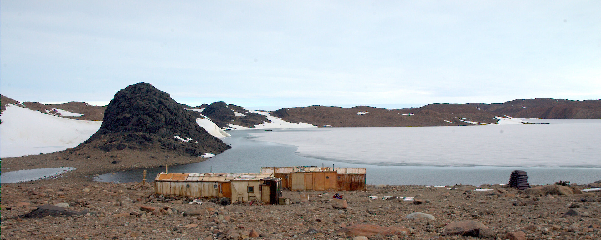 The old Polish buildings that make up Oasis station, overlooking Algae Lake, and a supply of empty gas bottles (right), used for heating and cooking.