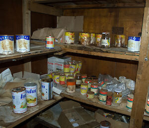 Tins of food lining shelves at Oasis station.