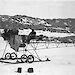 Vintage photo of a man with a small, wire framed air tractor