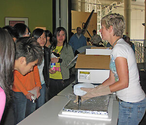 Ice core analyst, Tessa Vance, explains her work to school students.