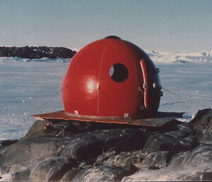 Igloo Satellite Cabin, also known as an apple hut, due to its round shape and red colour, in Antarctica