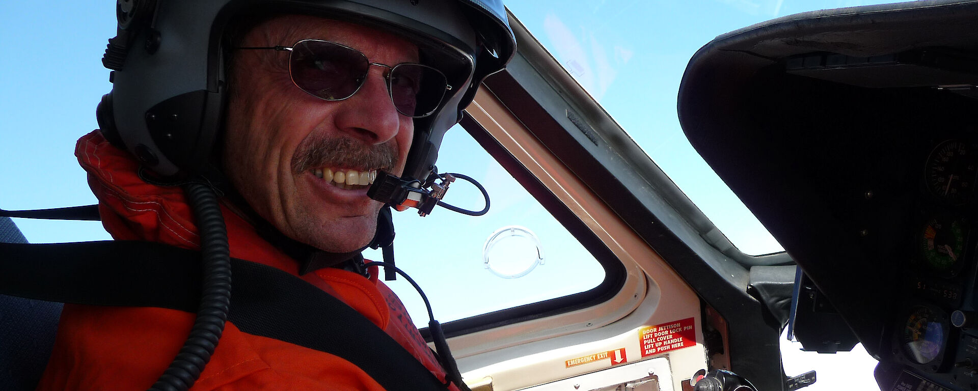 Pilot at the controls of helicopter