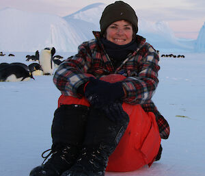 Robyn Mundy with emperor penguins in Antarctica