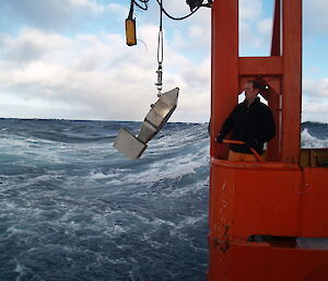 Man raising the ‘continuous plankton recorder’ from the ocean