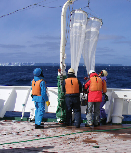 Workers with Norpac net, consisting of 330 micron and 110 micron nets side by side