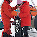 SIPEX scientists deploy a high definition video camera and lamp system to study krill under the sea ice.