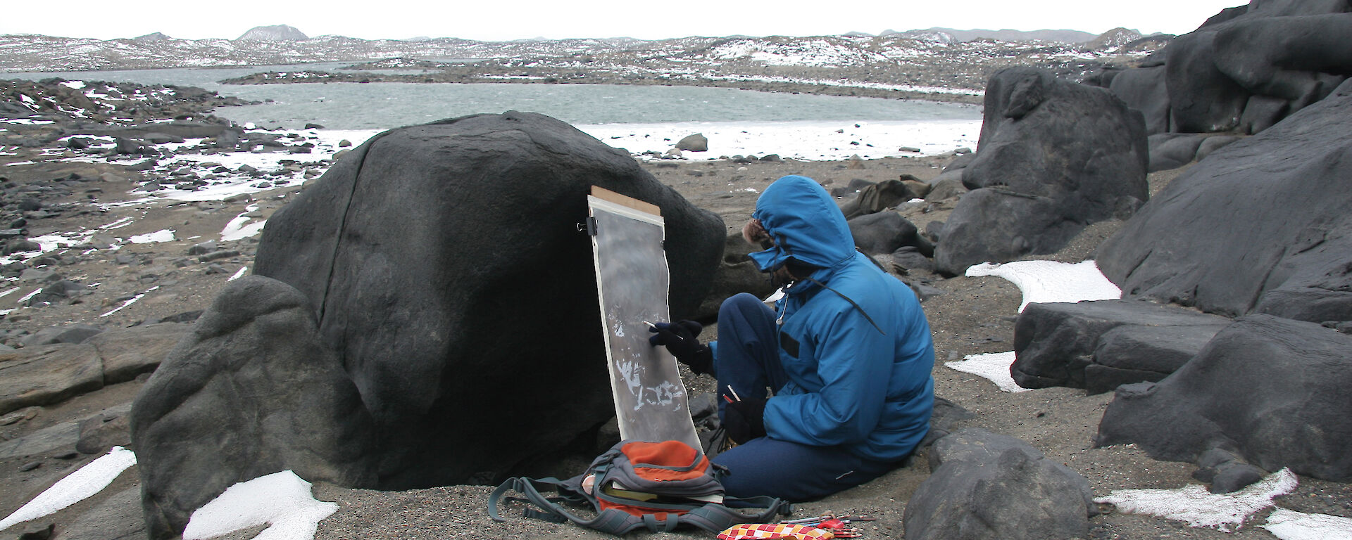 Nick paints on the beach near Brookes Hut in the Vestfold Hills