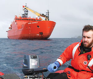 Rowan driving a zodiac during the 2005 summer resupply at Macquarie Island.