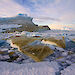 Overturned ice floes with green sea ice algae on their undersides.