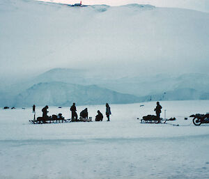 The stricken Dakota high up in crevasses, west of Mawson in December 1960. The Velocette and dog teams were used to help rescue navigational and photographic equipment from the aircraft.