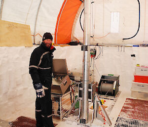 Dr Simon Sheldon from the University of Copenhagen operates the Danish Hans-Tausen drill used to extract the 303m, 2000 year ice core