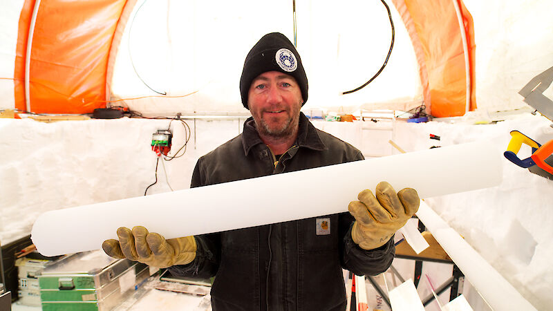 Aurora Basin Science Leader, Dr Mark Curran, holds part of the 2000 year ice core