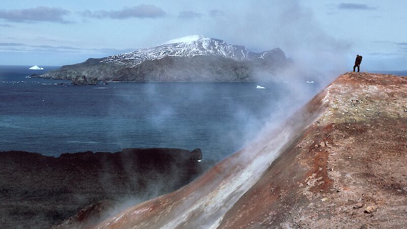A man stands in a cloud of volcanic steam in the Antarctic South Sandwich Islands