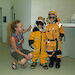ACE CRC research scientist Dr Jessica Melbourne-Thomas with some enthusiastic children dressed up like expeditioners