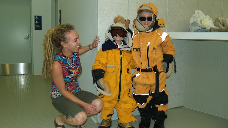 ACE CRC research scientist Dr Jessica Melbourne-Thomas with some enthusiastic children dressed up like expeditioners