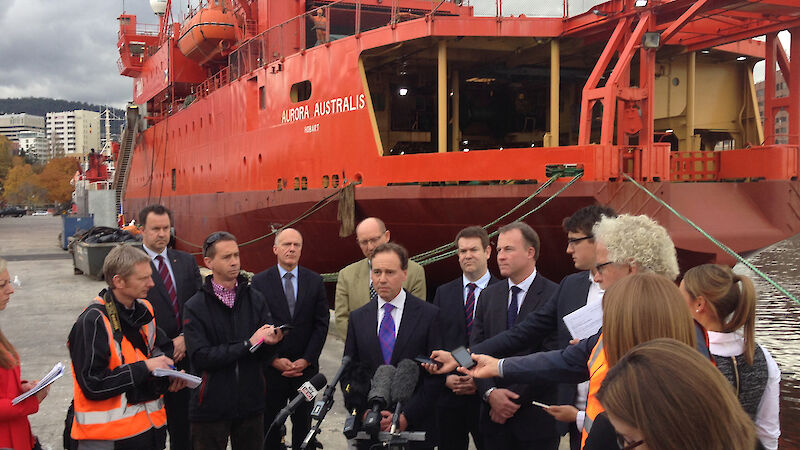 Federal Environment Minister, Greg Hunt, tells media about the new Australian icebreaker while standing in front of the Aurora Australis on the Hobart wharf