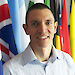 New CEP Chair, Ewan McIvor, standing in front of many nations’ flags