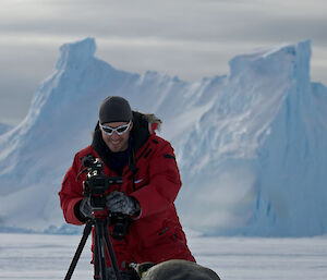 Nick Roden films an emperor penguin in Antarctica