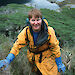 Barbara climbs a steep, thickly vegetated hill on the Argentine island Diego de Almagro.