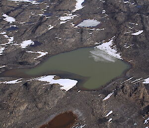 An aerial view of Organic Lake surrounded by the Vestfold Hills