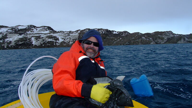 Professor Rick Cavicchioli takes samples from Deep Lake in the Vestfold Hills.