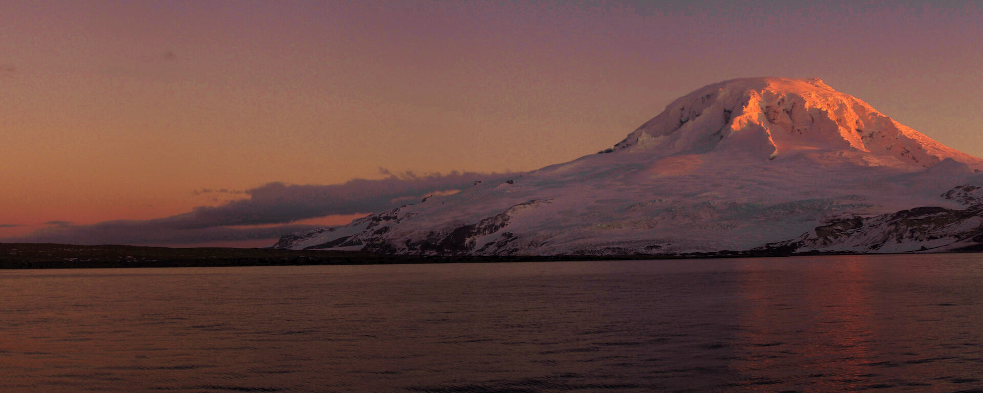 A pink sunset over Mount Mawson on Heard Island.