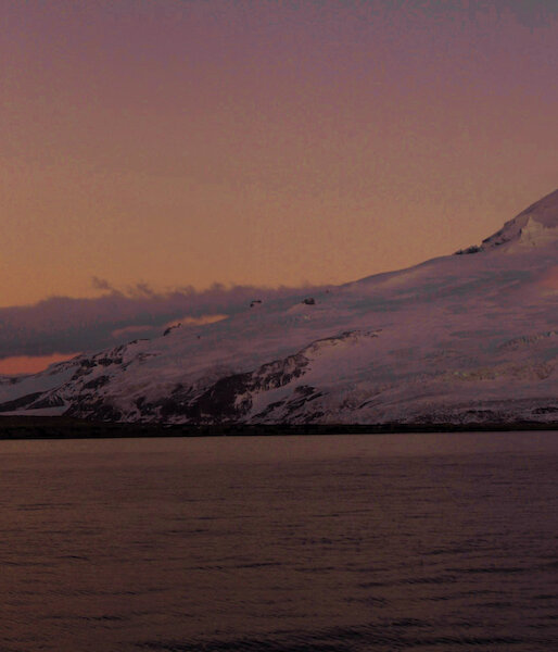 A pink sunset over Mount Mawson on Heard Island.