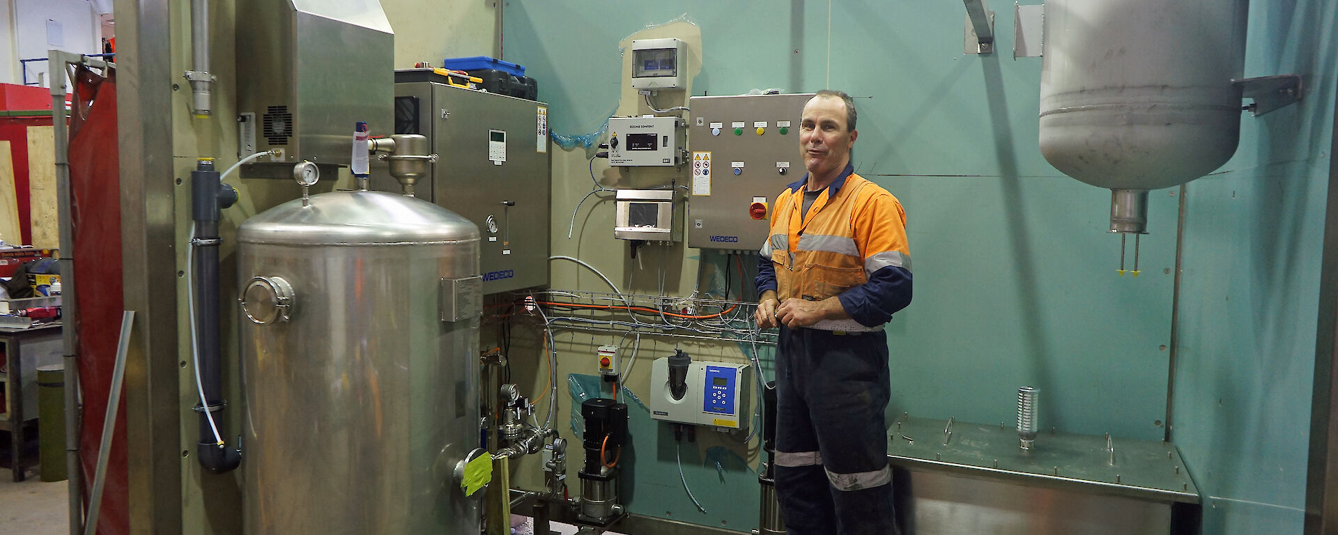 Welder, Stuart Norris, assists with the construction of the advanced treatment plant at the Australian Antarctic Division.