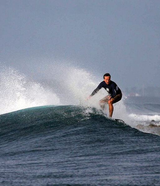 Nick surfing in the Maldives