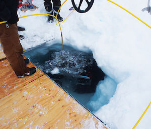 The Remotely Operated Vehicle being readied for deployment under the Antarctic sea ice.