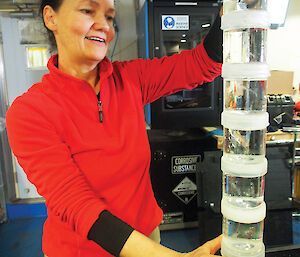 Dr Patti Virtue from the Institute of Marine and Antarctic Studies in Hobart checks krill involved in a growth rate experiment on the ship.