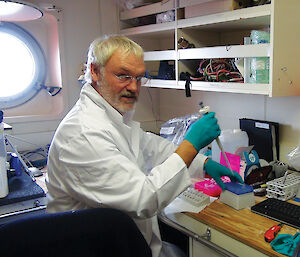 Dr Ulrich Freier processing freshly caught krill for RNA analysis, onboard the Aurora Australis.