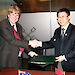 Dr Tony Fleming (left), Director of the Australian Antarctic Division, and Dr Qu Tanzhou, Director of the Chinese Arctic and Antarctic Administration, sign a Memorandum of Understanding at the Antarctic Treaty Consultative Meeting in June 2012.