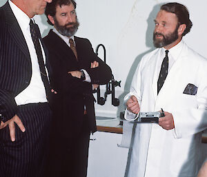 Dr Peter Gormly (right) explaining human adaption to cold weather experiments to Prime Minister Malcolm Fraser (left) and Chief Scientist Pat Quilty (centre) during the opening of the Australian Antarctic Division’s Kingston headquarters in 1981