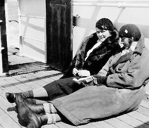 Ingrid Christensen (left) and Mathilde Wegger, sitting on the ship’s deck, on a voyage in 1931.