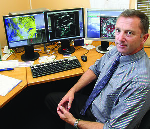 Dr Neil Adams in his Bureau of Meteorology office