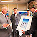 Prince Charles receives a photograph from Antarctic Division Director Dr Tony Fleming.