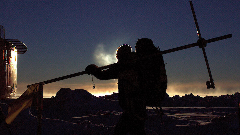 Scientist, Ernesto Trujillo-Gomez, carrying part of a radiometer mast back to the ship during SIPEX-II.