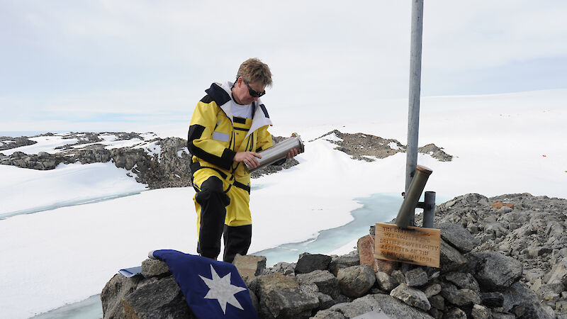Australian Antarctic Division Director Tony Fleming places a time capsule at Proclamation Hill above Mawson’s Huts, to mark the 100th anniversary of Mawson’s Landing at Commonwealth Bay in Antarctica.