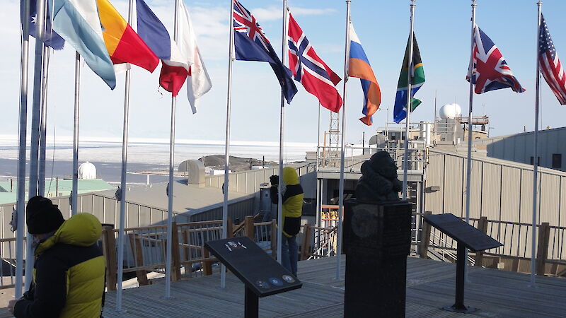 International flags fly at the National Science Foundation Chalet at McMurdo Station, Antarctica