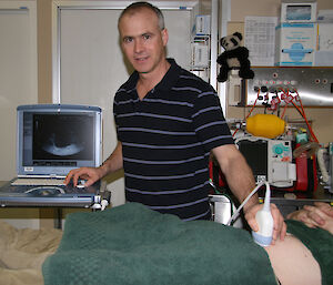 Dr Glenn Browning uses a three-dimensional ultrasound machine, installed at Mawson station in 2009 to collect images for specialist diagnosis