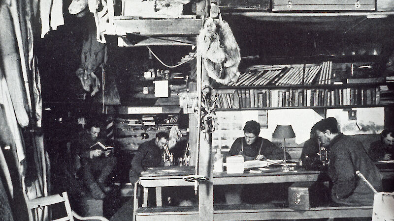 Dr Archie McLean and his companions in the living hut.