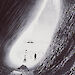 Herbert Ponting’s black and white image of the Terra Nova from an ice cave.